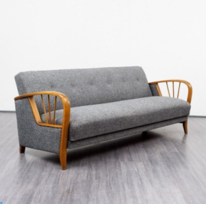 Gray sofa with wooden arms