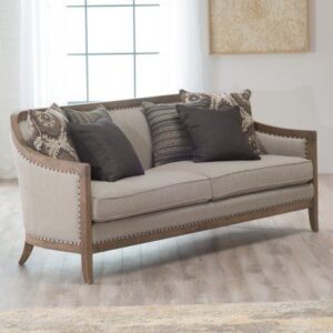 Elegant sofa with decorative pillows.