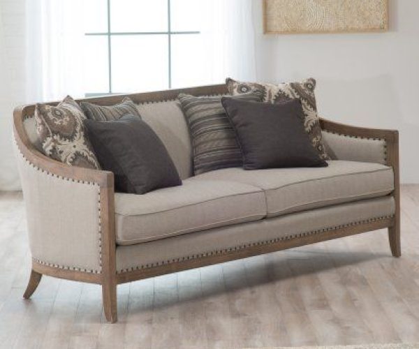 Elegant sofa with decorative pillows.